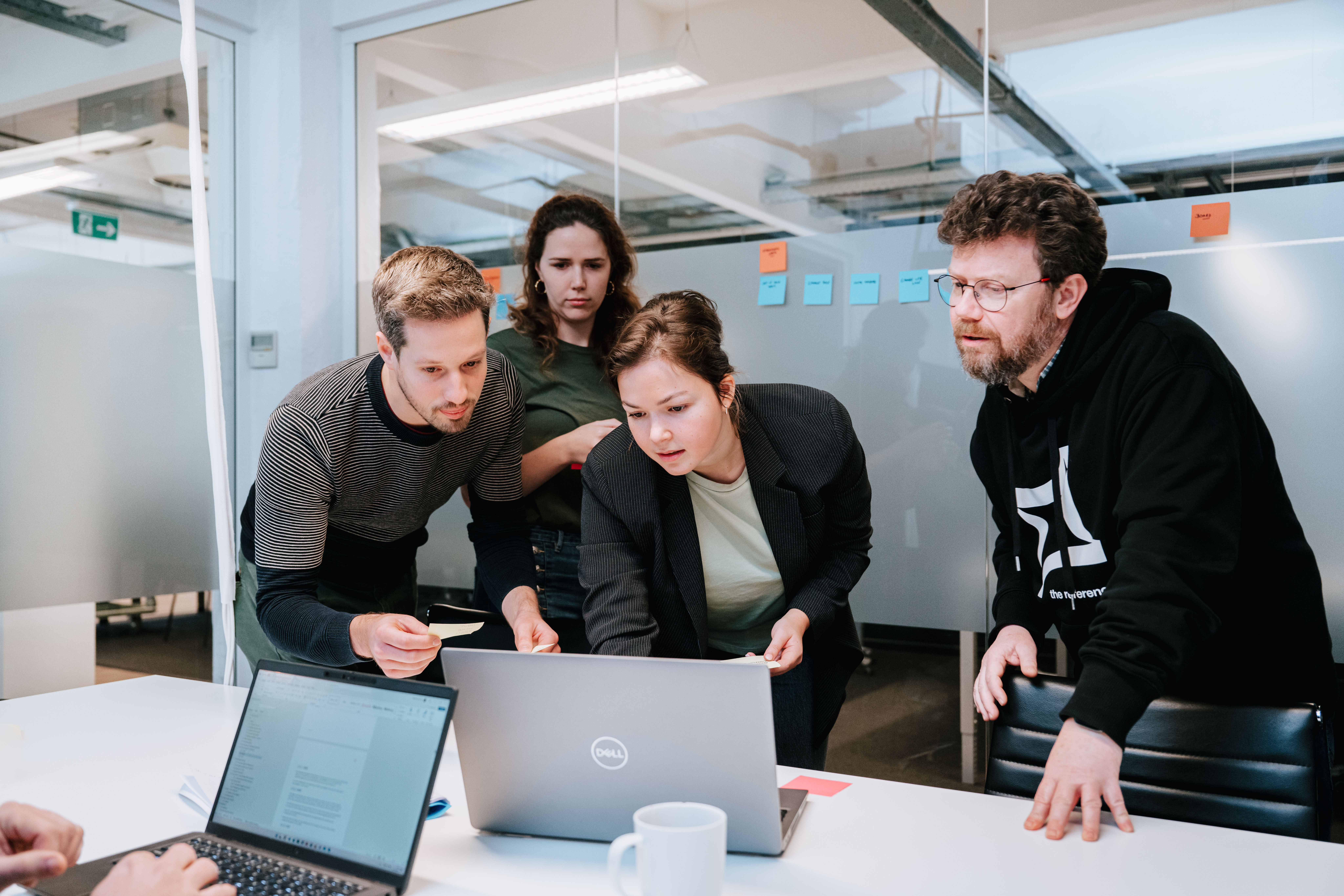 Four people working together during a work shop