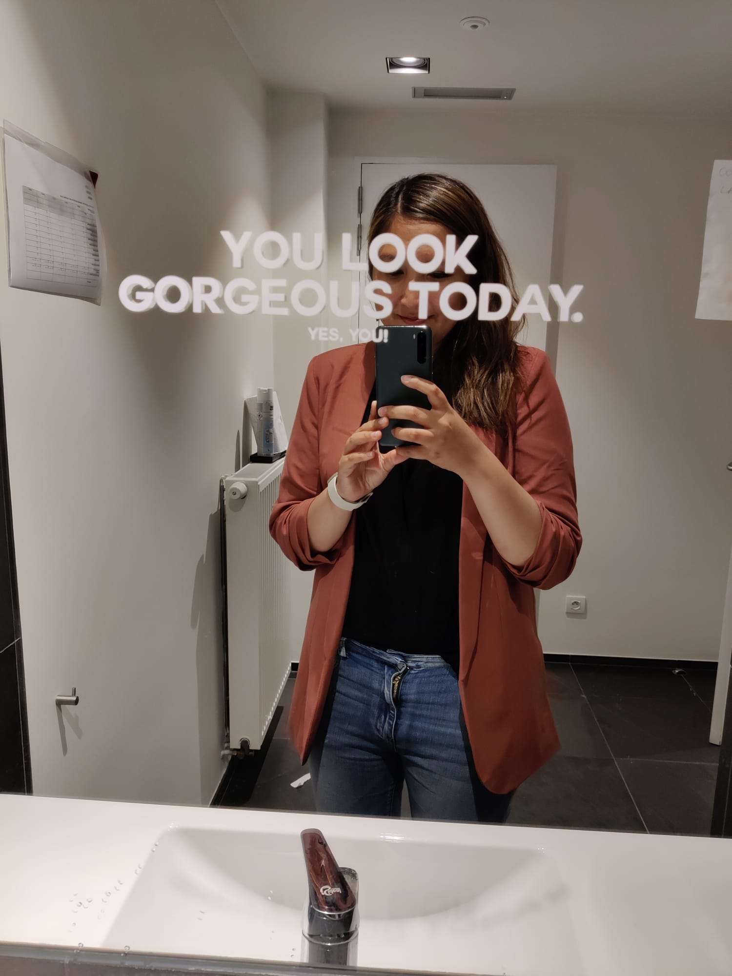 Naomi, DMC at The Reference staring in the mirror with the words 'you look gorgeous today' on