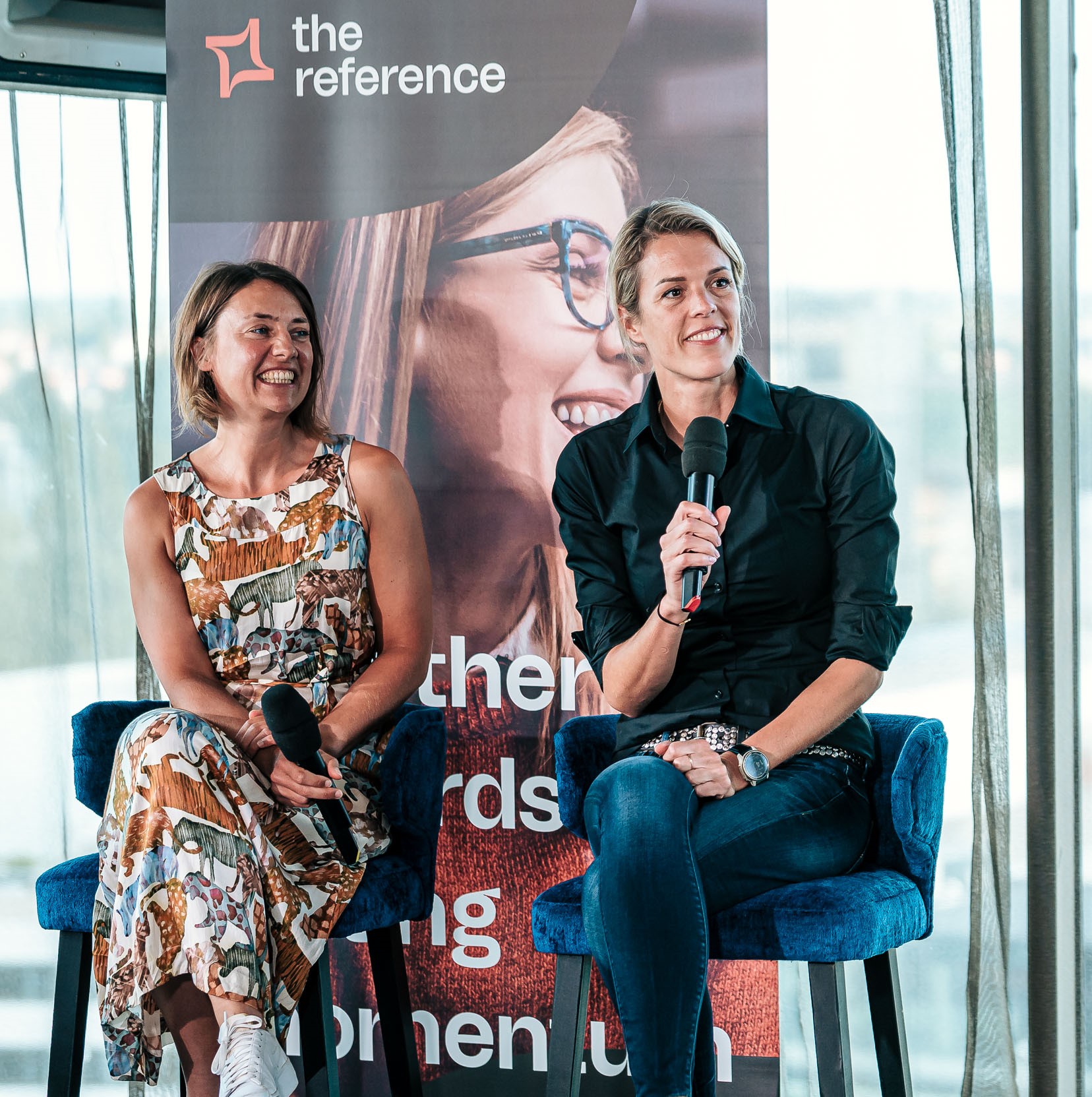 Picture of a colleague from The Reference and someone from commercetools sitting next to each other