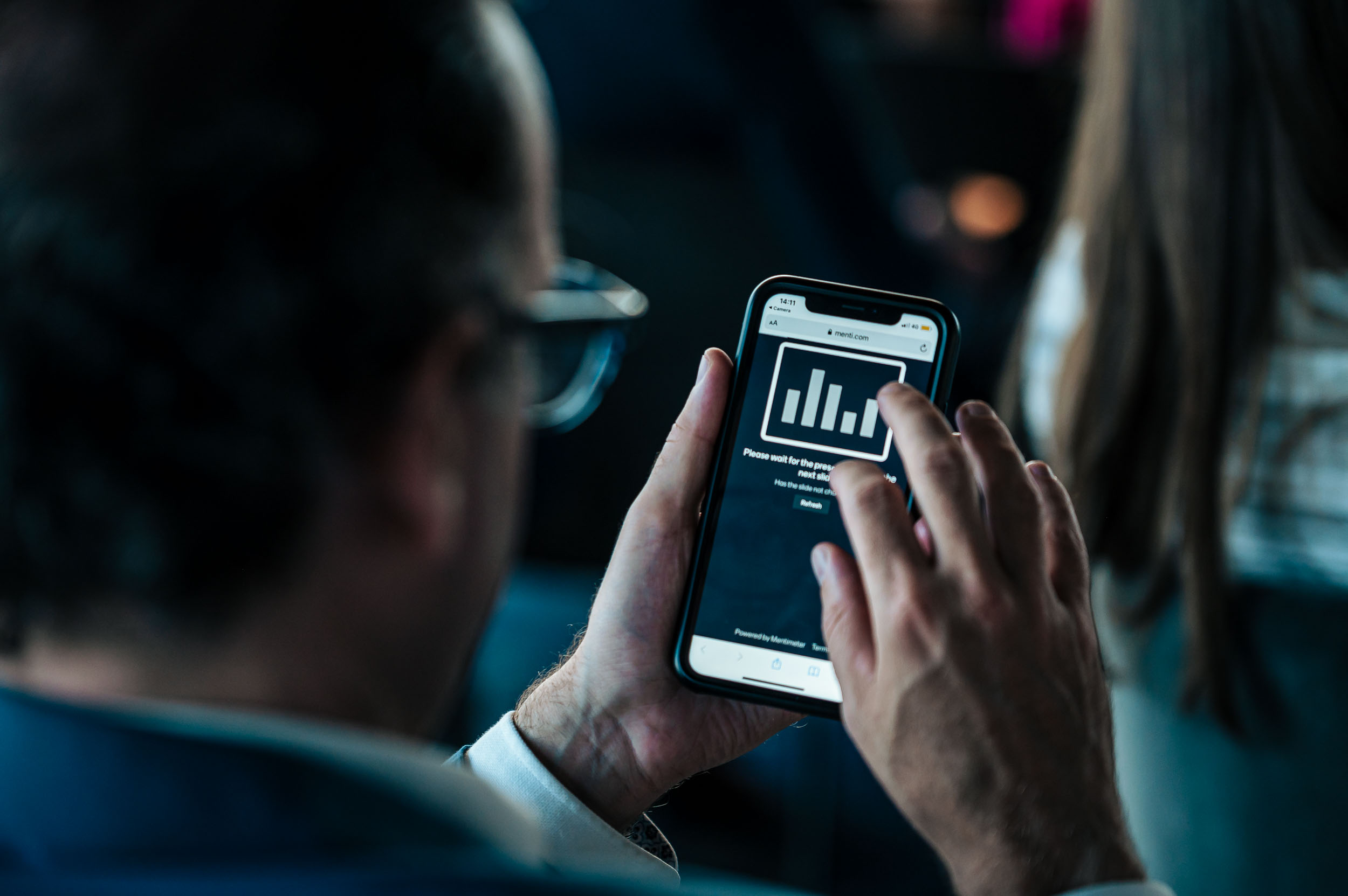 Employee scrolling on mobile phone 