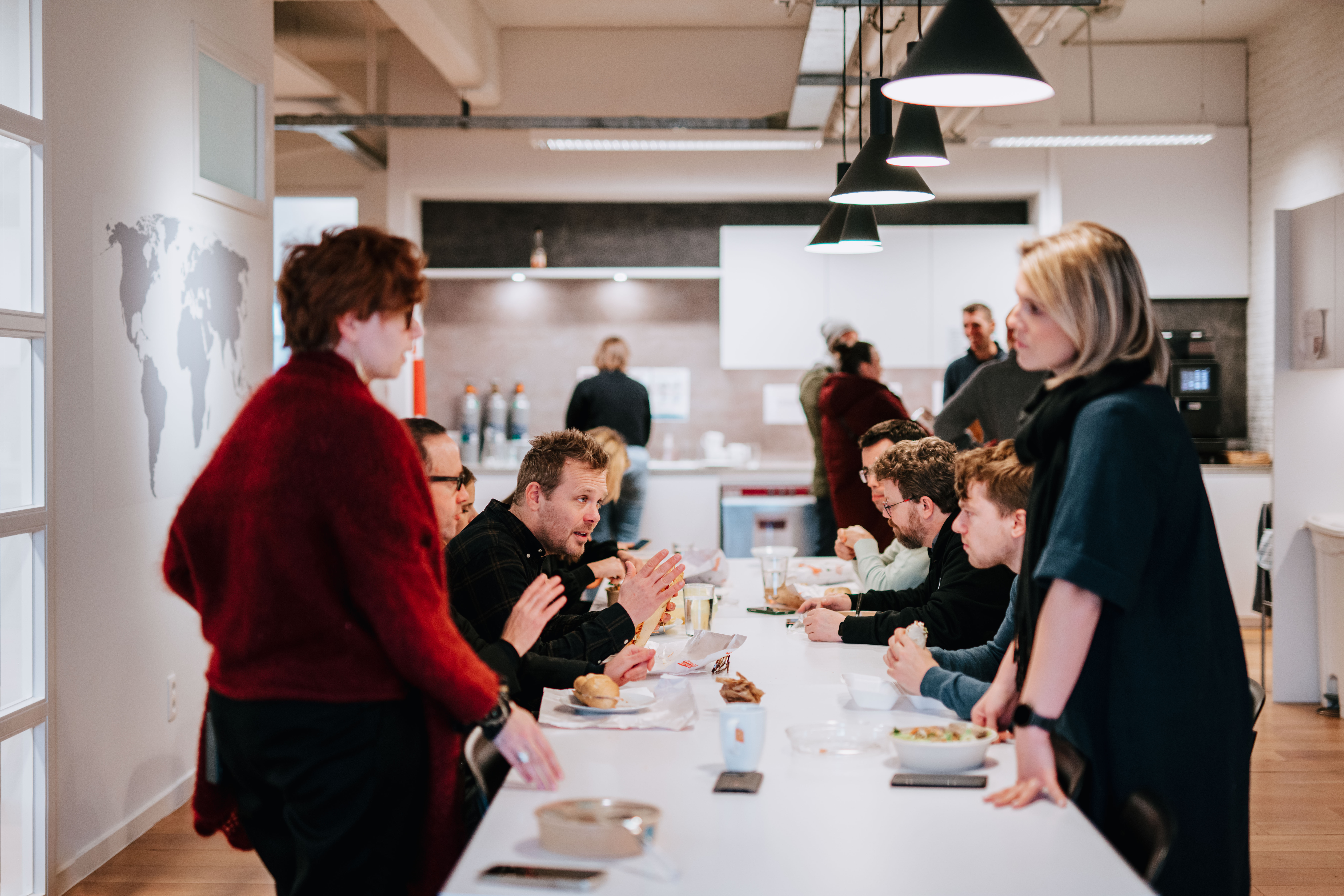Wide shot of colleagues having lunch together 
