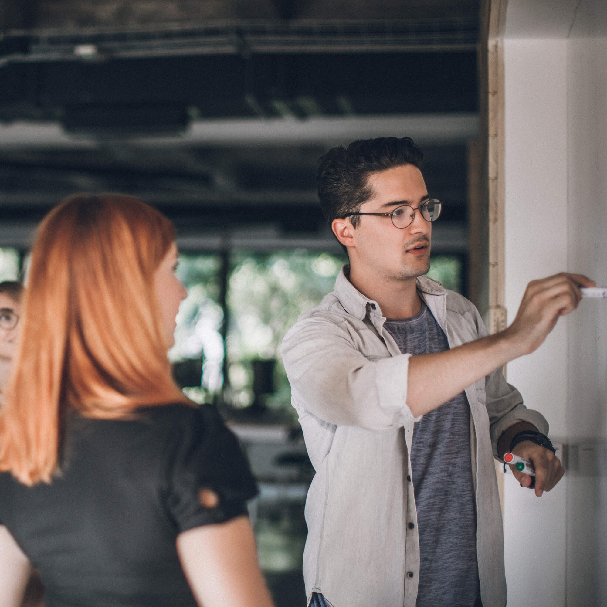 Person explaining with whiteboard