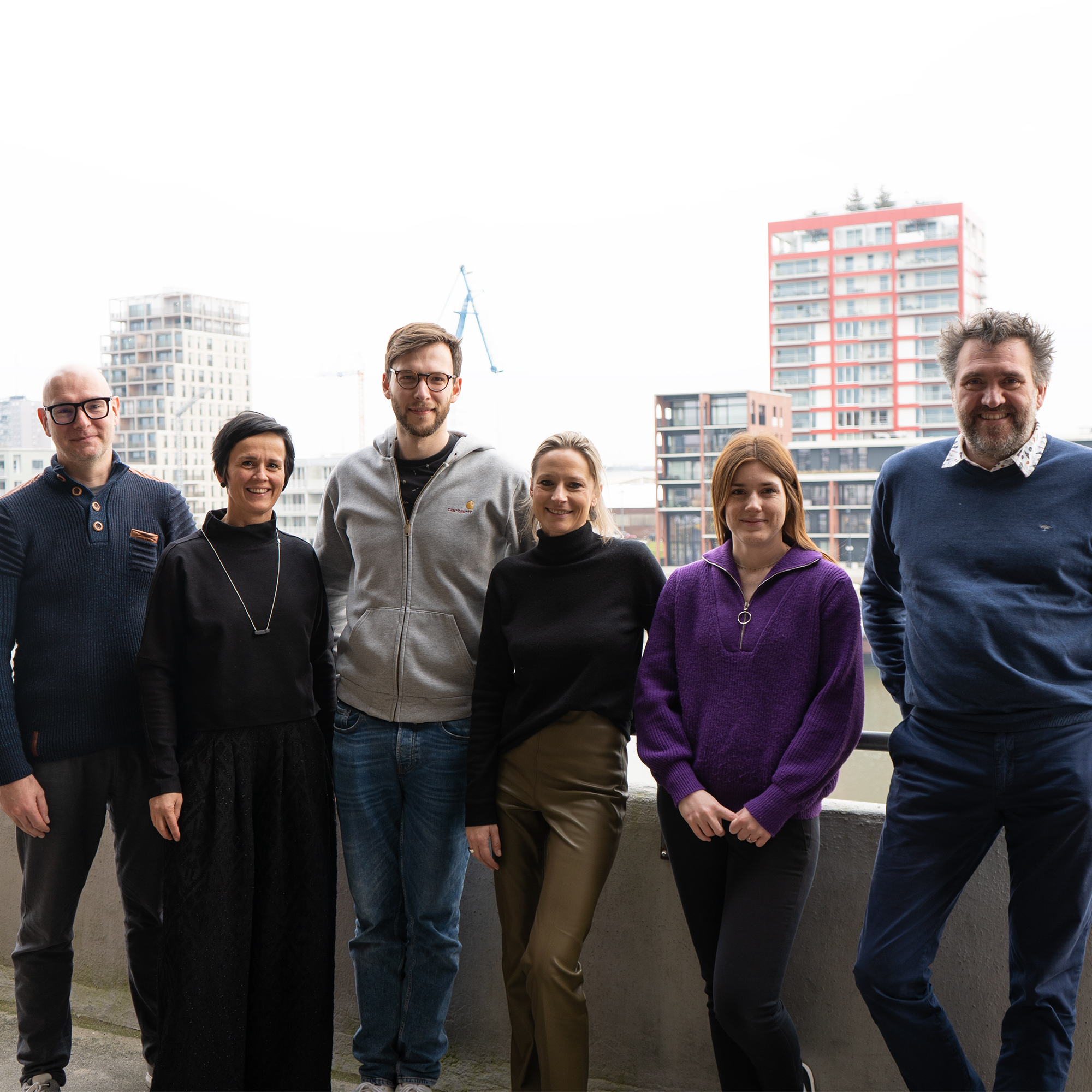 DPG Media employees together with the team from The Reference on the balcony at the Ghent office