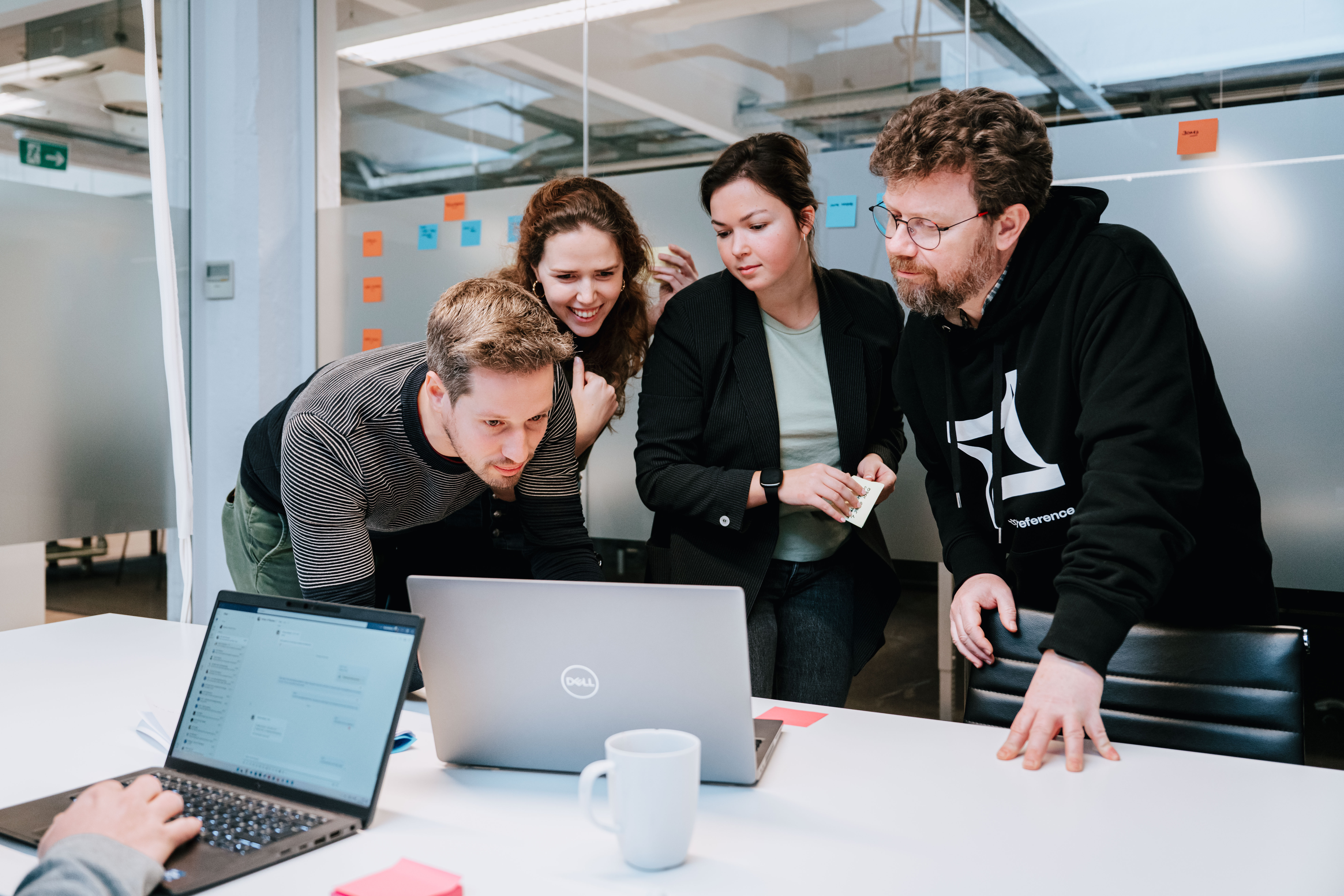 A person showing his colleagues something during a workshop