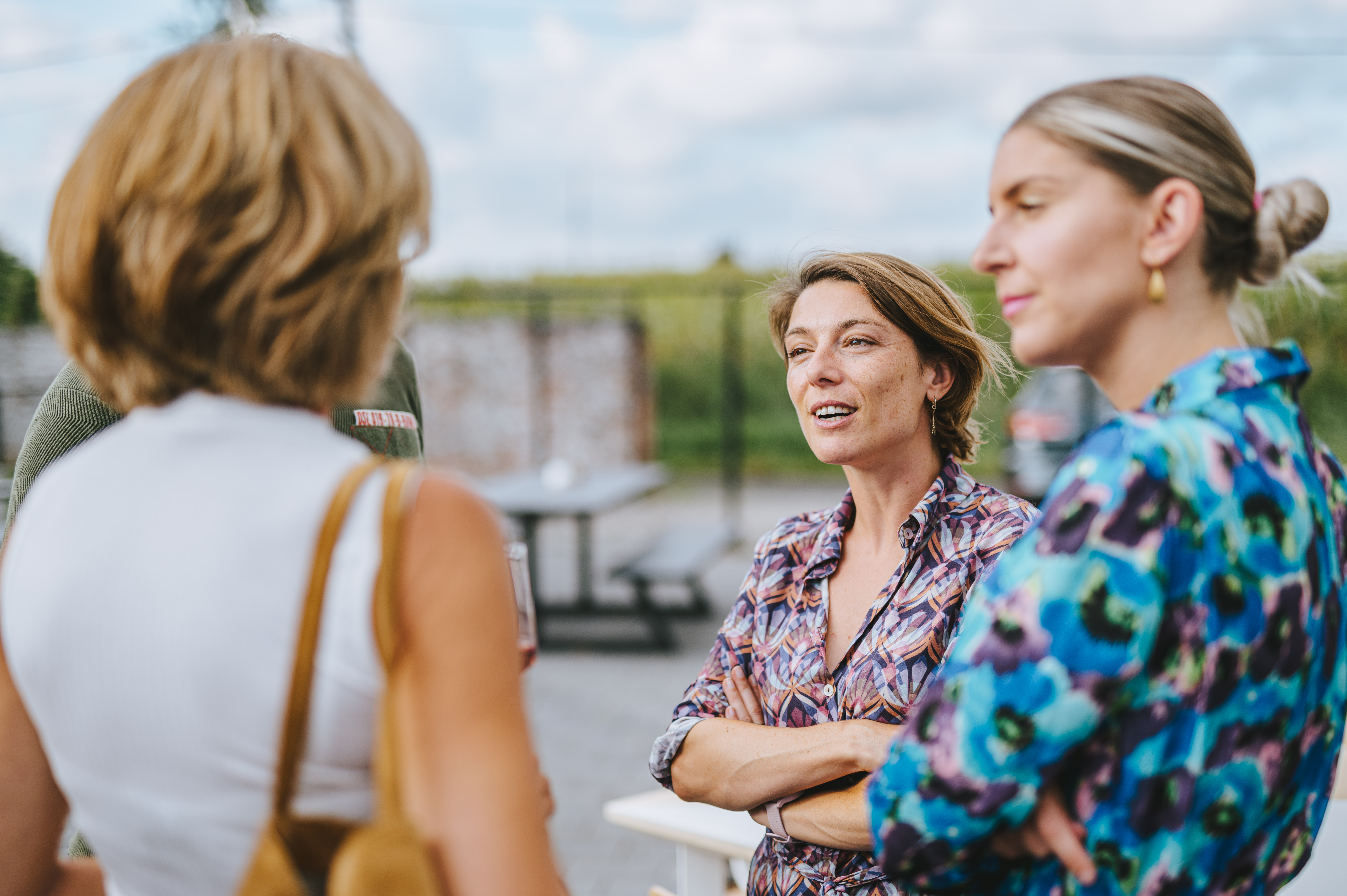 Four colleagues of The Reference casually talking with each other